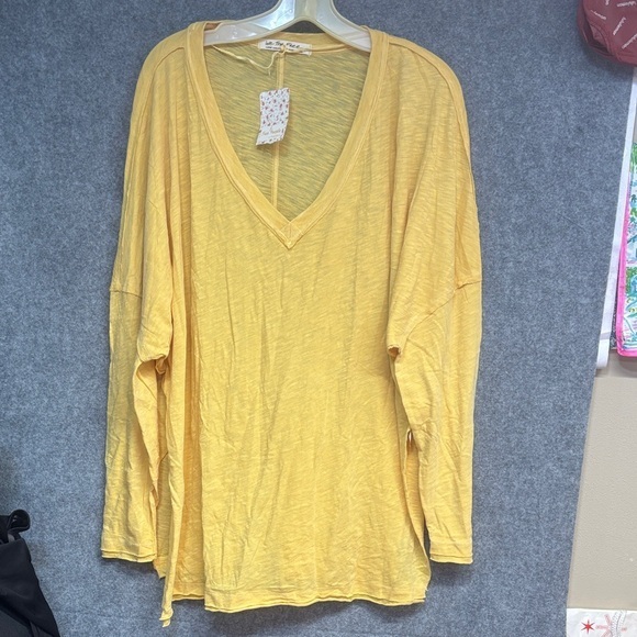 Free People Tops - Free People Yellow Long Sleeve V-Neck raw hem open sides cotton blend shirt L